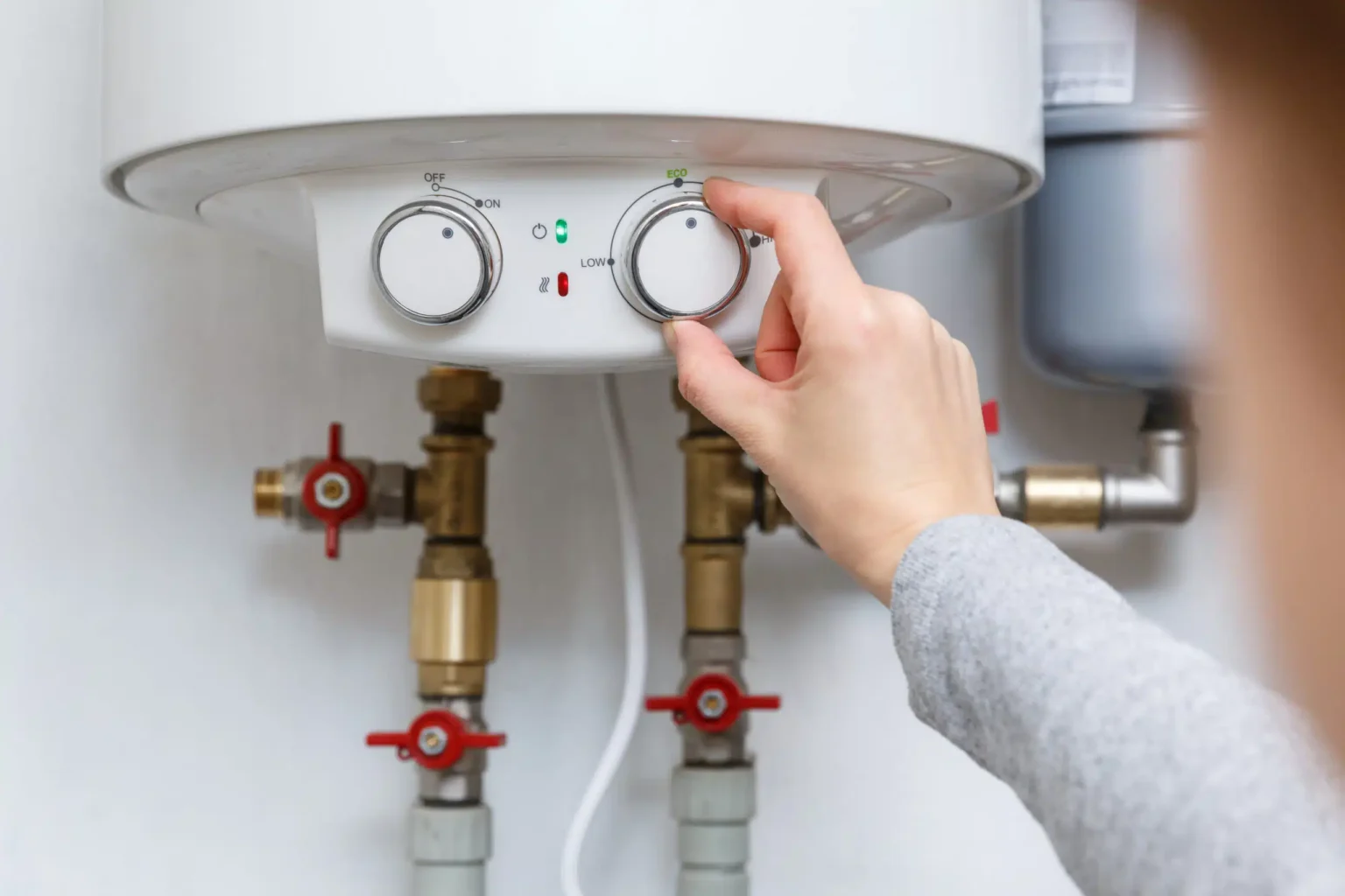 Technician adjusting a water heater in Paramount